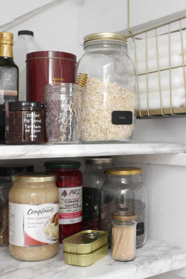 Victorian period organised pantry interior with old antique storage  stoneware jars